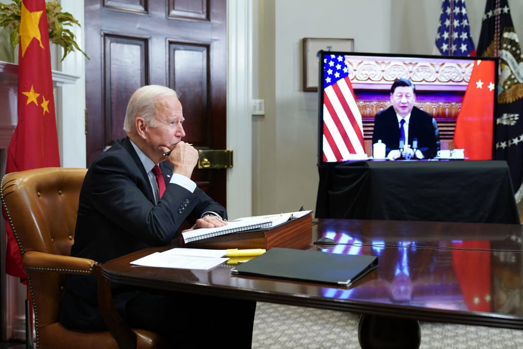 US President Joe Biden meets with China's President Xi Jinping during a virtual summit from the Roosevelt Room of the White House in Washington, DC,