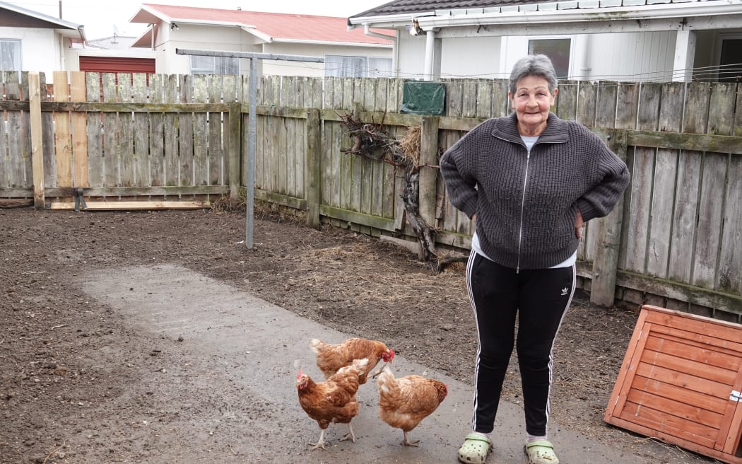 Robyn Dandy's backyard is full of mud after rubbish was removed. She says her chickens can't be blamed for the waste.