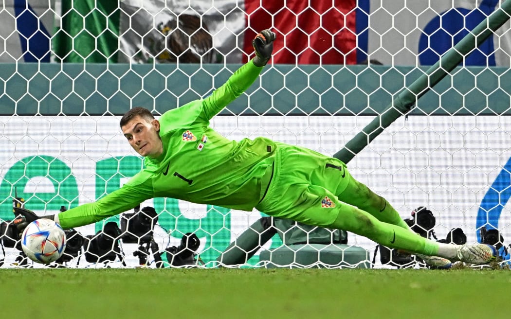 Croatia's goalkeeper Dominik Livakovic saves a penalty against Japan at the 2022 World Cup.