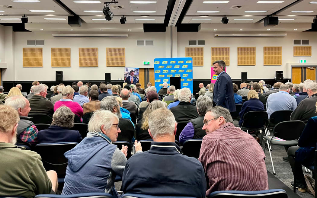 Seymour chats with attendees before the public meeting starts.