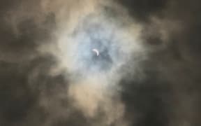 Clouds very briefly obscured the partial eclipse but cleared before the moment of totality, in Alliance, Nebraska.