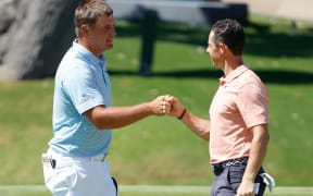 Bryson DeChambeau (L) and Rory McIlroy.