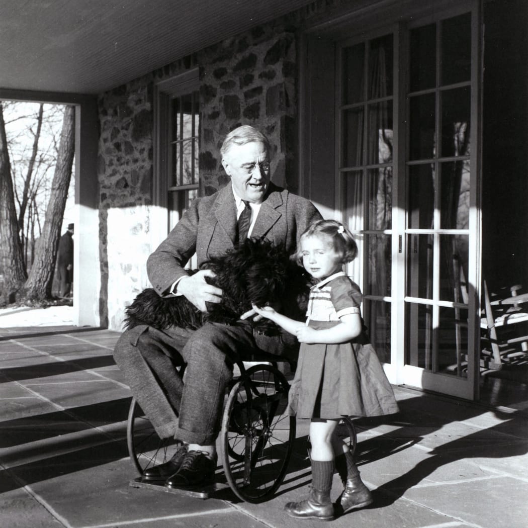 Franklin D. Roosevelt with Fala his dog and Ruthie Bie in Hyde Park, New York, 1941. There were few images taken showing President Roosevelt in his wheelchair. (Photo by Ann Ronan Picture Library / Photo12 via AFP)