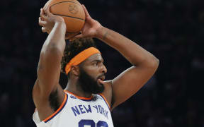 Mitchell Robinson of the New York Knicks looks to pass during the first half against the Boston Celtics at Madison Square Garden on Wednesday.