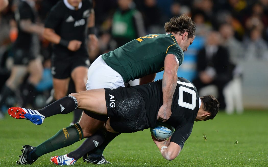 South African hooker Bismarck Du Plessis hits Daniel Carter.
