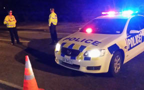 Police at the scene of the homicide investigation in Taita.