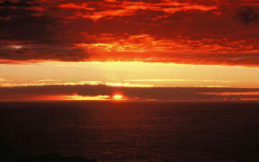 The Chatham Islands sunrise on the first morning of the year 2000. Sourced from Te Ara.