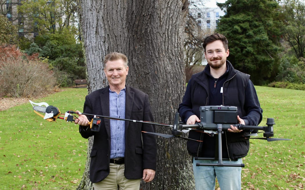 Professor Richard Green and Dr Sam Schofield with the new chainsaw drone they've developed as part of the UC Vision research team project.