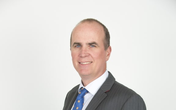 A portrait of immigration lawyer Alastair McClymont.