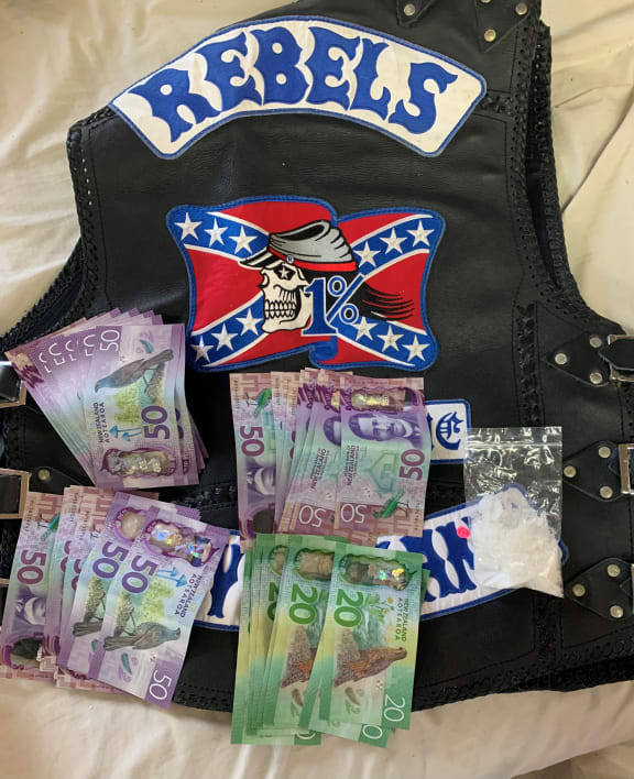 Cash and drugs seized during a police operation against the Rebels MC gang.