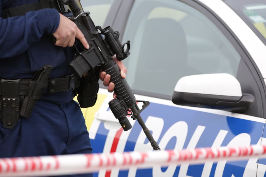 An armed officer.