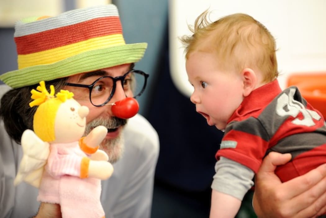 A clown doctor at work.