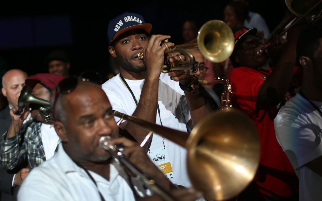Band members play during a second line parade marking the 10th anniversary of Hurricane Katrina on August 29, 2015 in New Orleans, Louisiana