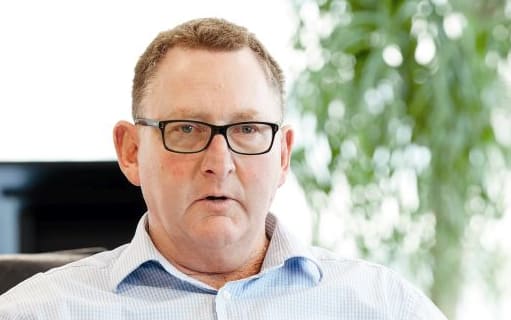 Super Fund Chief Executive, Adrian Orr, at his desk