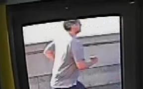 CCTV footage of a jogger who appeared to push a woman in front of a bus in west London