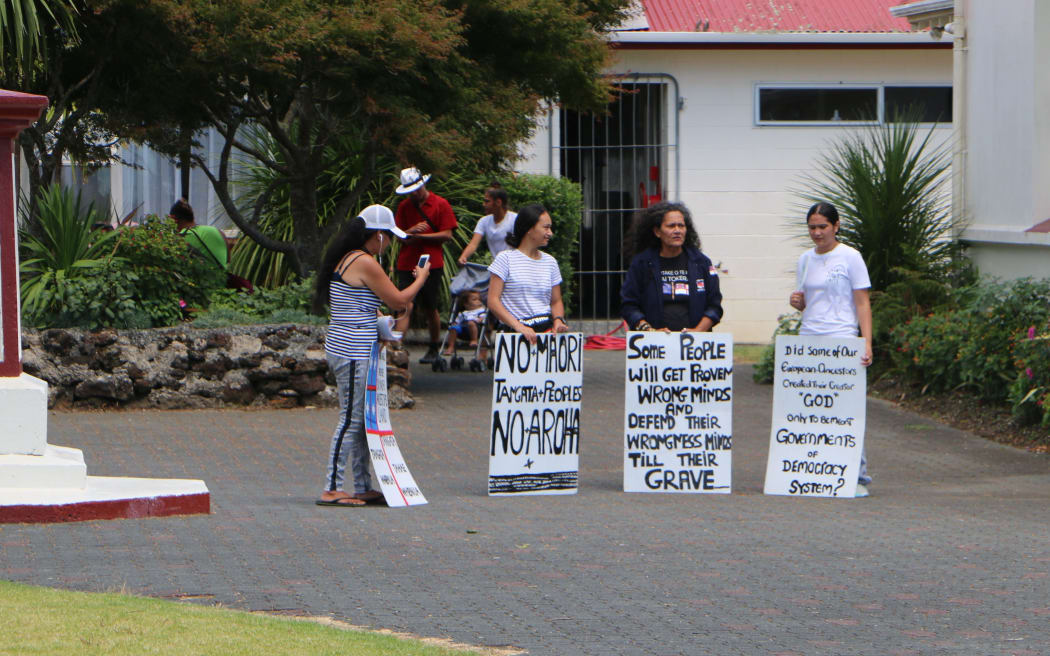 Three women were protesting inside Te Tii grounds.