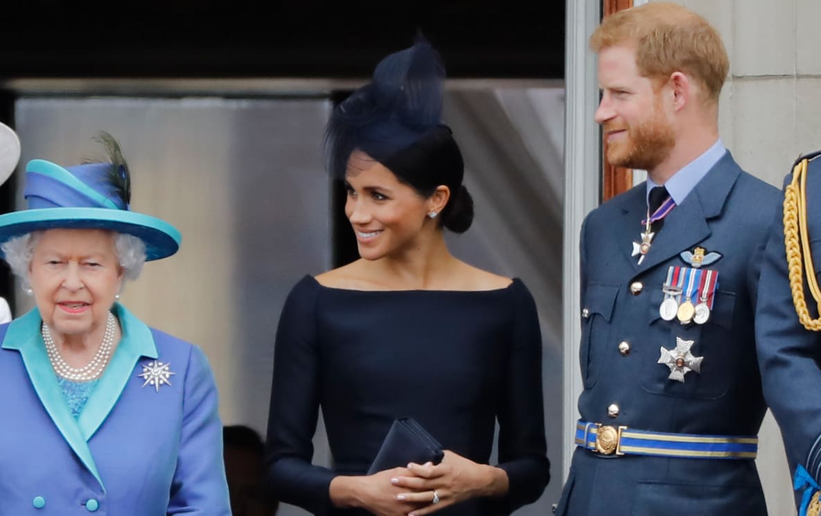 Queen Elizabeth II, Meghan, Duchess of Sussex, Prince Harry, Duke of Sussex stand on the balcony of Buckingham Palace on July 10, 2018.