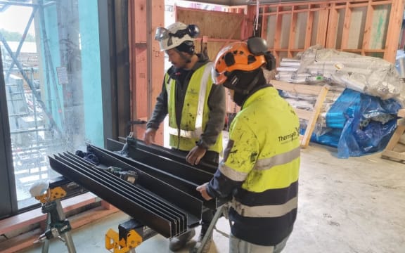 Construction workers putting the final touches to the new East Wing at Taranaki Base Hospital in New Plymouth.