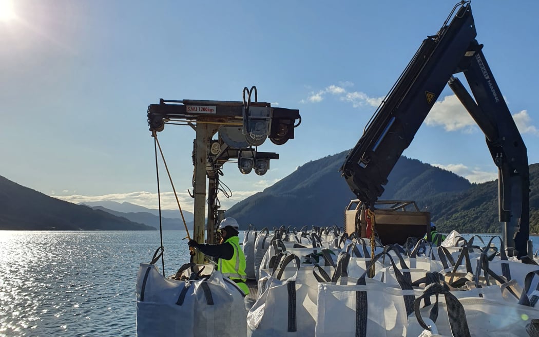 Sanford vessel Lady Marie deposits the first bag of mussel shells.