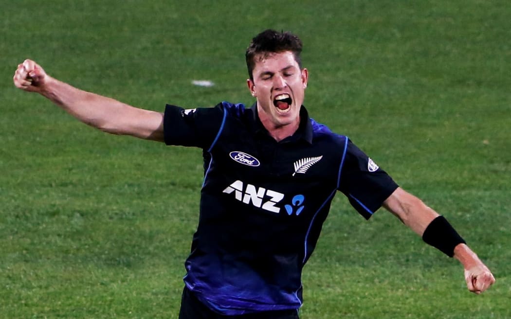 The Black Caps fast bowler Adam Milne celebrates taking a wicket.