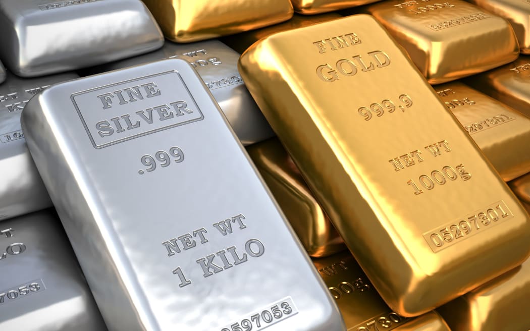 Silver ingot and gold bullion.