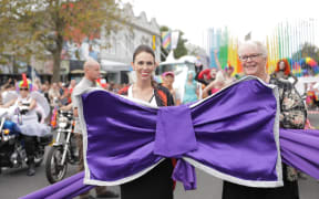 Prime Minister Jacinda Ardern and Lexie Matheson of the Auckland Pride Festival board.