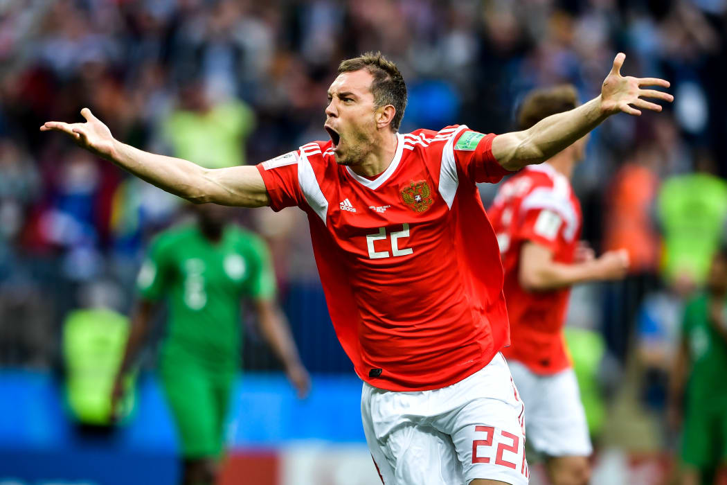 Artem Dzyuba of Russia celebrates after scoring a goal against Saudi Arabia in their Group A match during the 2018 FIFA World Cup in Moscow, Russia, 14 June 2018.
