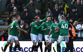 Plymouth striker Ryan Hardie, centre, celebrates scoring from the penalty spot for the only goal in his side's upset win over Liverpool at Home Park in Plymouth, 9 Feb, 2025.