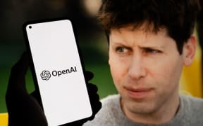 Sam Altman and the OpenAI logo displayed on a phone and screen after OpenAI fired him from being CEO of the company seen in this photo illustration in Brooklyn, NY, USA on November 17th, 2023. (Photo Illustration  by Meir Chaimowitz/NurPhoto) (Photo by Meir Chaimowitz / NurPhoto / NurPhoto via AFP)