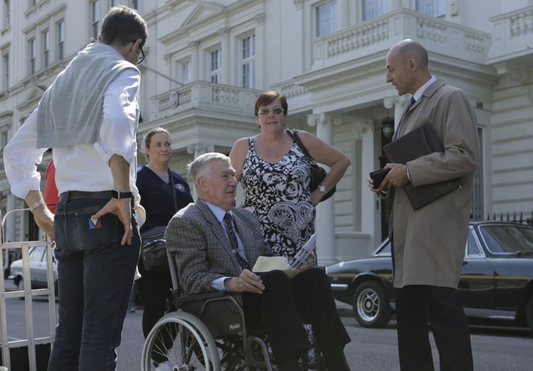 Max Vernon (wheelchair) talks to actor Mark Strong on the set of 6 Days.