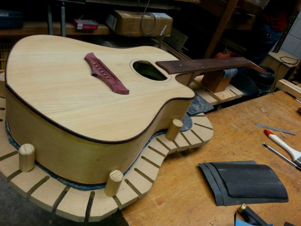 Putting the finishing touches on Sinead O'Connor's guitar