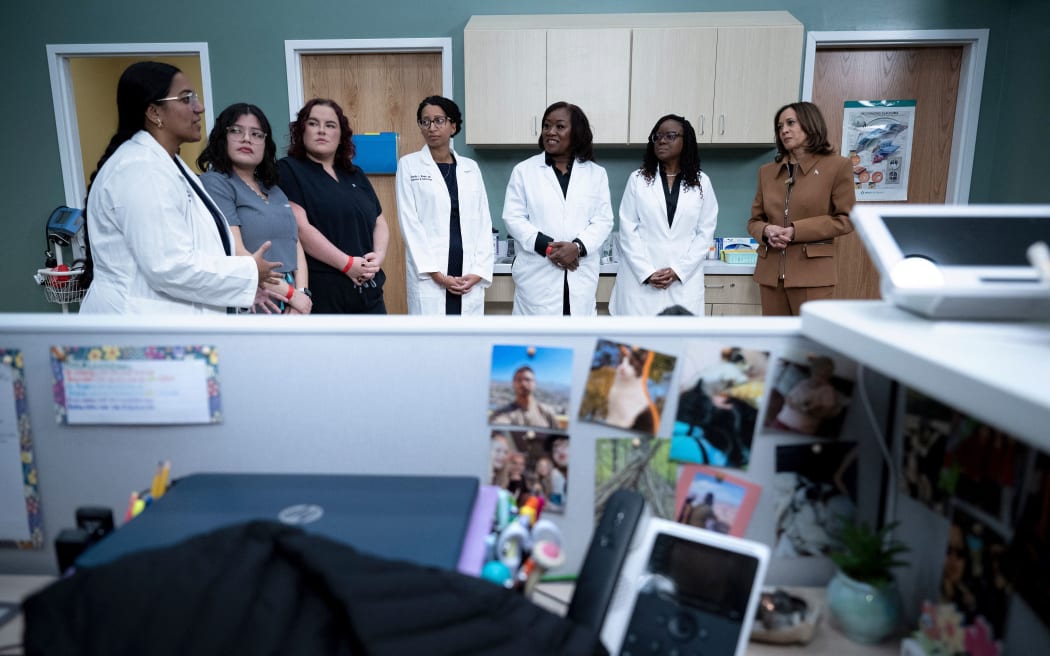 US Vice President Kamala Harris speaks with healthcare providers at a doctor's clinic on 26 October, 2024, in Portage, Michigan.