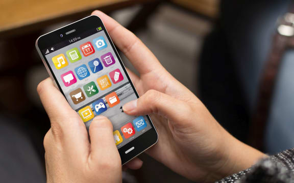 communications concept: girl using a digital generated smart phone. All screen graphics are made up.