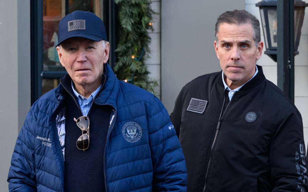 A November 29, 2024 photo shows US President Joe Biden and son Hunter Biden stepping out of a bookstore while shopping in Nantucket, Massachusetts on November 29, 2024. - Biden on Sunday issued an official pardon for his son Hunter, who is facing sentencing for two criminal cases related to tax evasion and the purchase of a firearm. (Photo by Mandel NGAN / AFP)