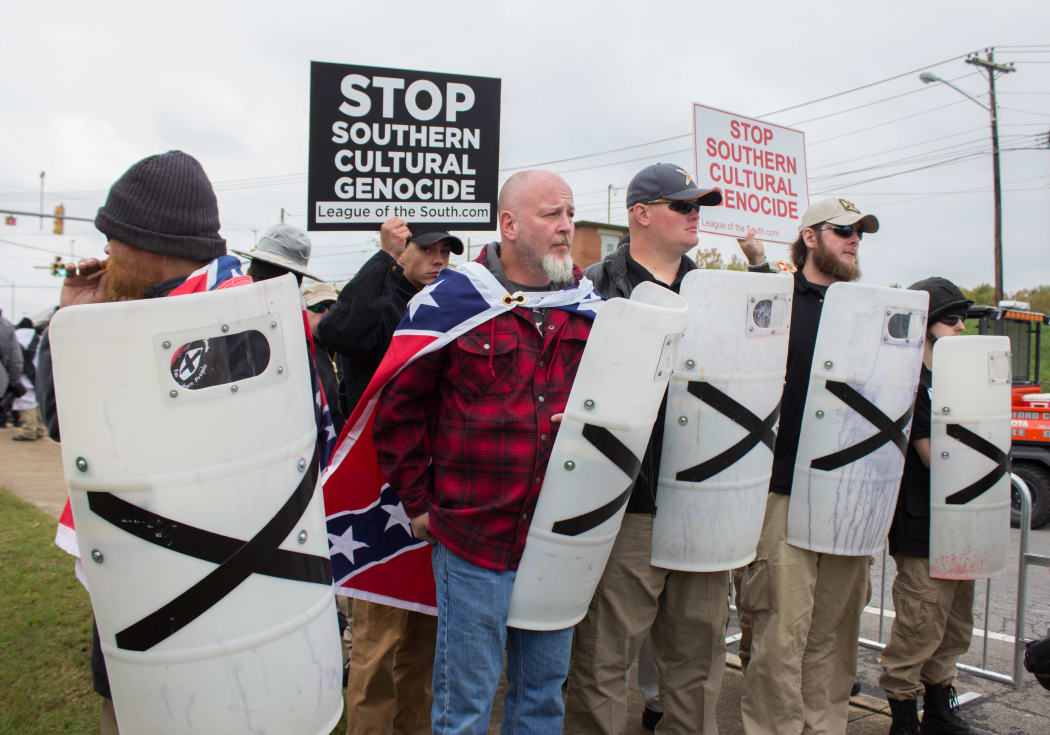 Members of the 'League of the South' line up with shields during a 'White Lives Matter' rally in Shelbyville, Tennessee.