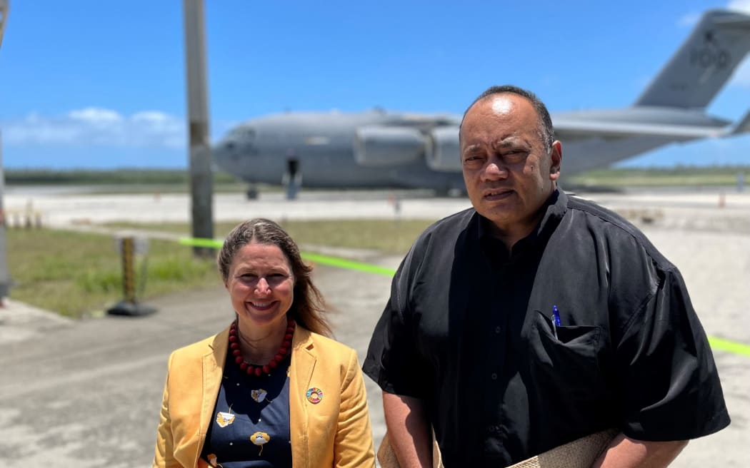 Tonga's Prime Minister Siaosi Sovaleni (right) joined by Australia's High Commissioner to Tonga Rachael Moore (left) to witness the arrival of the first Royal Australian Air Force C-17A Globemaster III aircraft from Australia delivering humanitarian assistance on January 20, 2022.