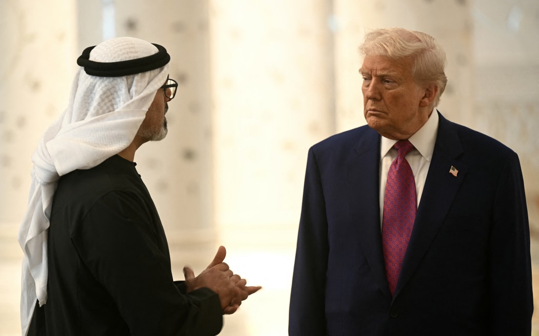 US President Donald Trump listens to Abu Dhabi's Crown Prince Sheikh Khaled bin Mohamed bin Zayed Al Nahyan, as he visits the Sheikh Zayed Grand Mosque in Abu Dhabi on May 15, 2025. The United Arab Emirates is the third leg of Trump's visit to the region, which has already taken him to Saudi Arabia and Qatar. (Photo by Brendan SMIALOWSKI / AFP)