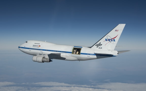 SOFIA in flight with the telescope door open.