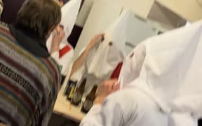 Quiz contestants at the Kaimai Settlers Committee fundraiser 19 August 2023 dressed as Ku Klux Klan KKK complete with petrol can
picture supplied