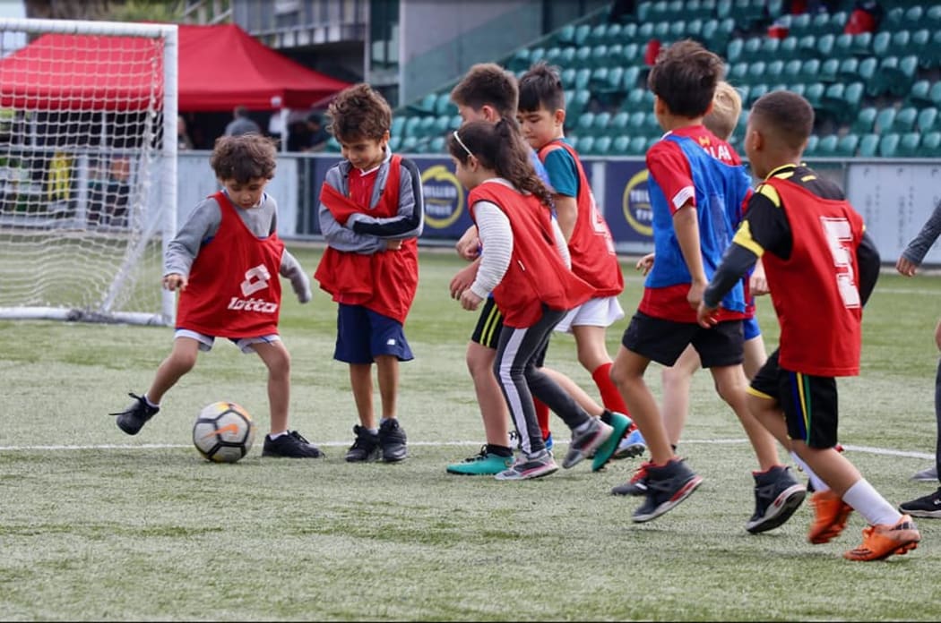 Children playing football at a Canterbury Resilience Foundation event