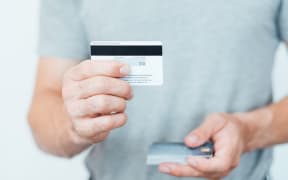credit card CVV2 code. online payments security. man holding plastic cards.