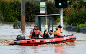 Emergency workers evacuate residents from flooded properties in the Maribyrnong suburb of Melbourne on October 14, 2022.