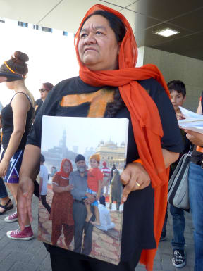 Lisa Singh with a photo of her family.