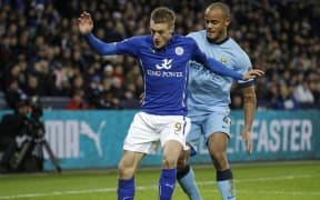 Jamie Vardy of Leicester City is challenged by Vincent Kompany of Manchester City, in December 2014.