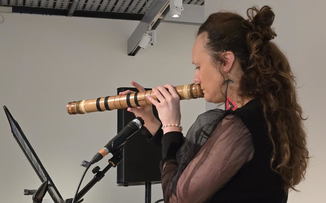 Pā'utu-'O-Vava'u-Lahi Dr Adriana Māhanga Lear performing a fangufangu piece at Pataka museum