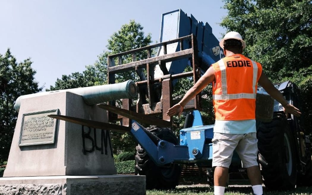 RICHMOND, VA - JULY 02: Crew prepare to remove a confederate cannon monument that marks the location of the second line of the confederate defenses of Richmond city on July 2, 2020 in Richmond, Virginia.