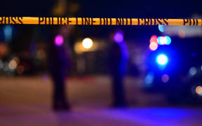 Police tape is pictured at the scene near the intersection of Garvey and Garfield avenues in Monterey Park, California, where police are responding to reports of multiple people shot.