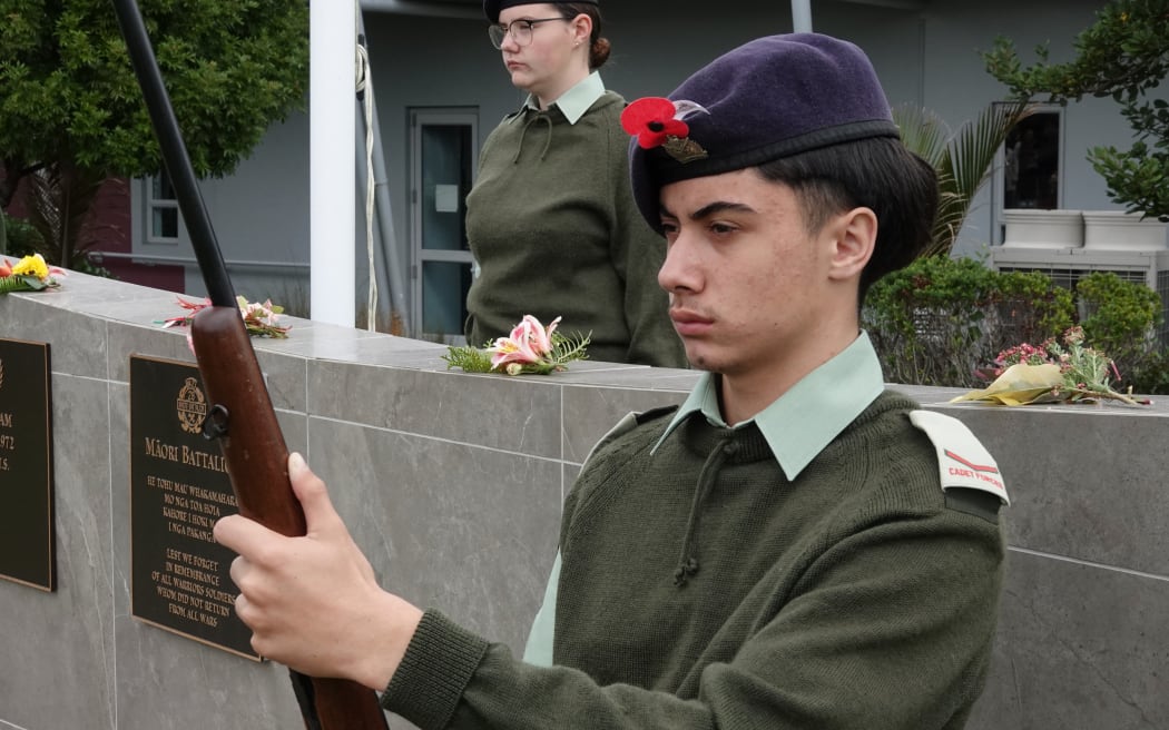 Manatuwhenua Taurua-Jenkins, 14, of the Kerikeri Cadet Unit, stands guard at the memorial wall.