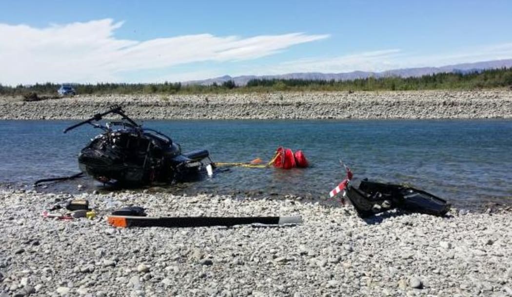 The helicopter crashed in shallow water.
