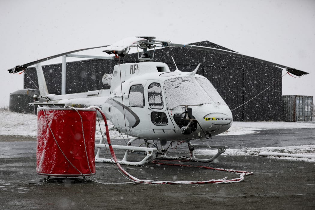 Snow grounds helicopter crews fighting Lake Pukaki fire.